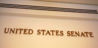 Mitch McConnell: Navigating Power and Influence in American Politics United States Senate sign on wall