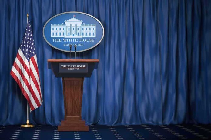 1165119412 featured image Empty White House podium and American flag.