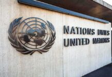 United Nations sign and emblem on building wall