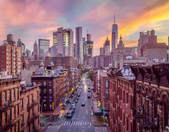 1093445573 featured image City skyline at sunset over busy urban street