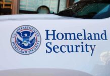 Homeland Securitya logo and text on vehicle door