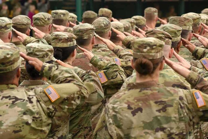 Soldiers in uniform saluting during a ceremony