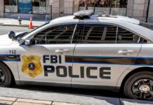 FBI police car parked on city street