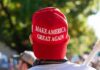 Red Make America Great Again hat on persons head