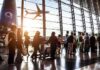 People in line at busy airport terminal
