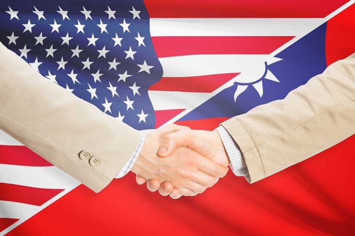 283346210 featured image Two people shaking hands with USA Taiwan flags