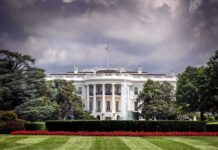White House front view with dark clouds above