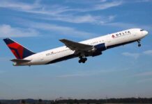 Delta airplane taking off from runway