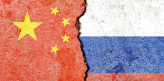 Chinese and Russian flags divided by a crack