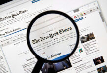 Magnifying glass over The New York Times website