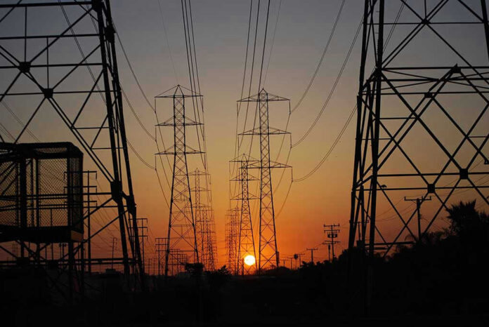 Transmission towers at sunset