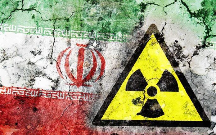 A cracked wall featuring the Iranian flag and a nuclear warning cx