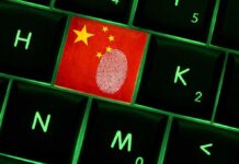 Close up of a keyboard key featuring the Chinese flag and a fingerprint