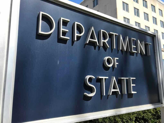 Department of State sign in front of building.