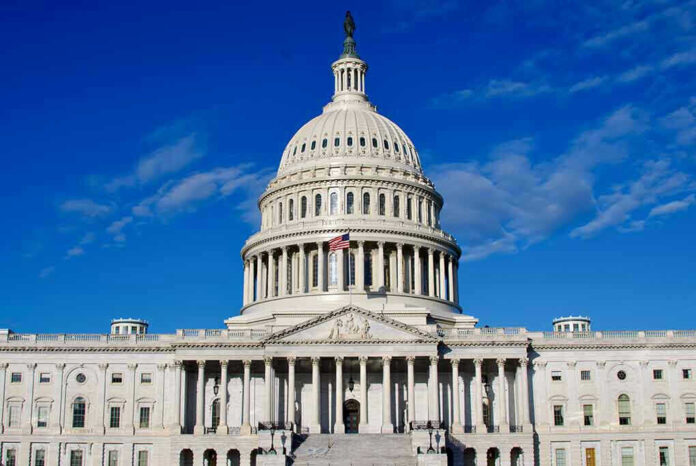 US Capitol Building against blue sky.