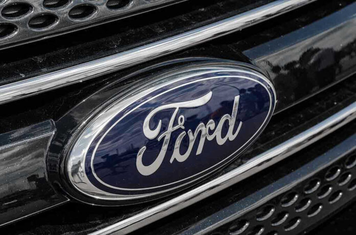 Ford logo on car grille close-up.