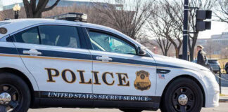 White House CHAOS: Secret Service Car Ignites! United States Secret Service police car on roadside.