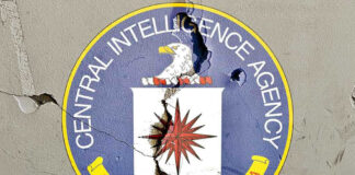 Cracked CIA logo on weathered wall