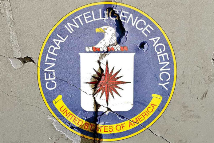Cracked CIA logo on weathered wall