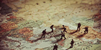 Toy soldiers on a world map background