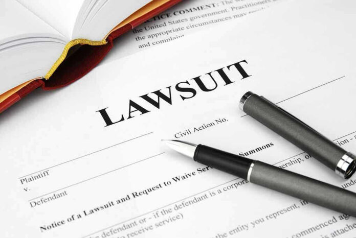 Legal document titled Lawsuit with pen and book