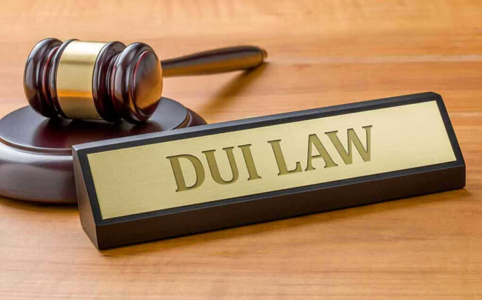 Gavel and DUI Law nameplate on desk.
