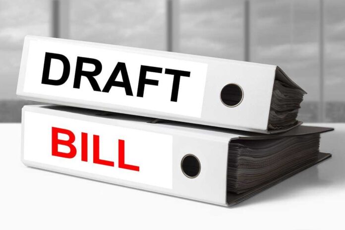 shutterstock_238590376.jpg Two file folders labeled DRAFT and BILL stacked on a desk