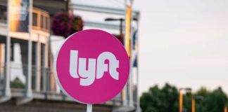 Rideshare Driver Killed—Mystery Deepens Lyft sign in an outdoor urban environment