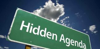 HISTORIC Election OUTCOME–RADICAL AGENDA AHEAD Road sign displaying the phrase Hidden Agenda against a blue sky