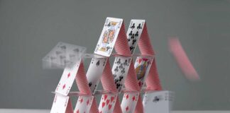 Mayor’s HYPOCRITICAL Move: Orders REVOKED! A house of cards collapsing with some cards in motion