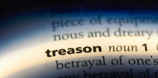 The word treason highlighted in a dictionary.