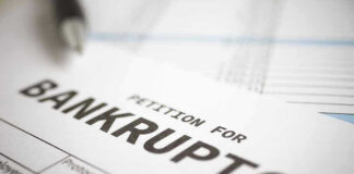 Petition for bankruptcy document with pen.