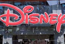 Bright red Disney logo displayed on a storefront window
