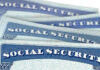 LIMITING Social Security CHECKS PROPOSED Several Social Security cards stacked together.