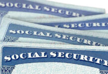 LIMITING Social Security CHECKS PROPOSED Several Social Security cards stacked together.