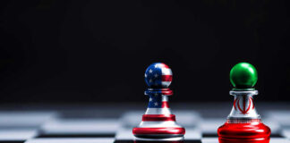 Chess pieces with USA and Iran flags on board.