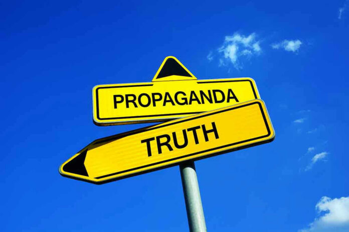 Yellow signs: Propaganda left, Truth right. Blue sky background.