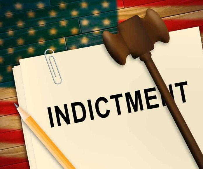 A legal document labeled 'INDICTMENT' with a gavel and pencil