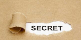 MYSTERY–Omar’s Winery DISSOLVES Days After SCRUTINY A torn piece of brown paper revealing the word SECRET underneath