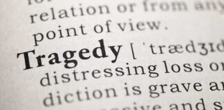 Military Base DESTROYED — Pilot Training Suspended Indefinitely Close-up of the word 'Tragedy' in a dictionary with its definition