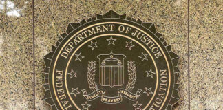 Bald Eagle Killer Faces Federal Hammer FBI seal on a marble wall.