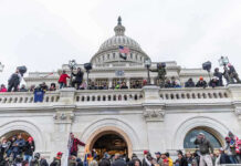 Criminal Release: Judge Greenlights Boston’s Defiance Crowd gathered on steps of Capitol building.