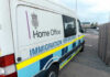 Shocking Plan: Arrest Federal Agents! White immigration enforcement van parked by roadside