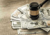 Jackpot Lawsuits Shock NC Marriages! Gavel on a pile of hundred-dollar bills.