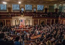 Uproar: Foreign-Born Lawmakers Under Fire! A crowded congressional chamber with members in discussion