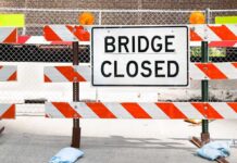 Fatal Collapse Shocks Seoul Demolition Site A Bridge Closed sign surrounded by safety barriers and fencing