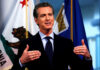 Federal Drilling Plan Sparks Santa Barbara Fight Man speaking with flags in the background