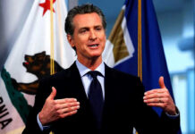 Federal Drilling Plan Sparks Santa Barbara Fight Man speaking with flags in the background