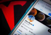 Trillionaire Shock: Musk Lights Fuse Phone screen showing Twitter profile with spacescapes.