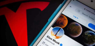 Trillionaire Shock: Musk Lights Fuse Phone screen showing Twitter profile with spacescapes.